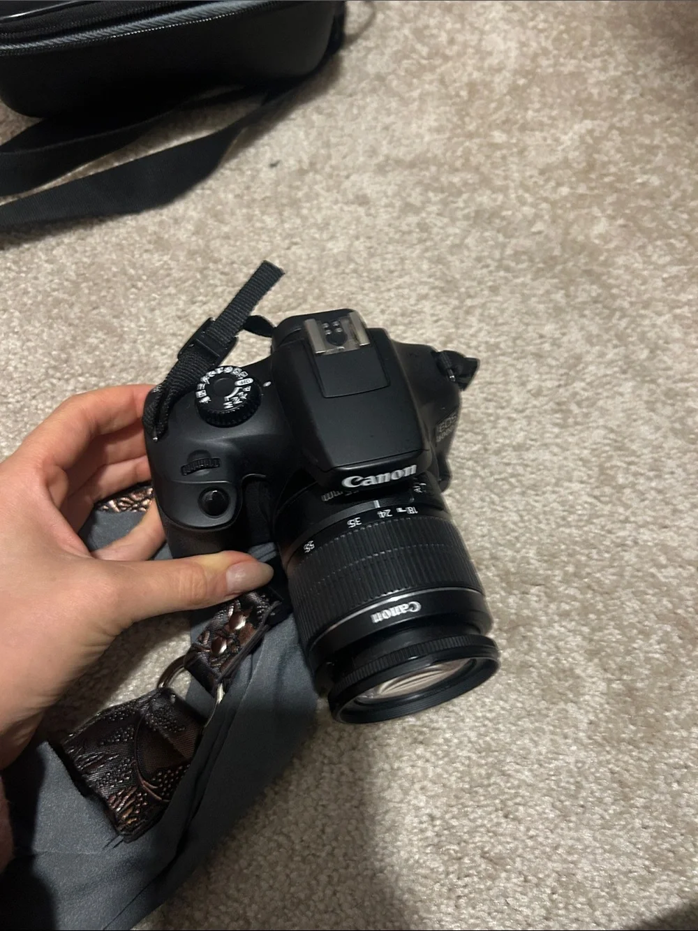 Canon EOS Rebel T1000 - DSLR Camera with Case and Decorative Strap